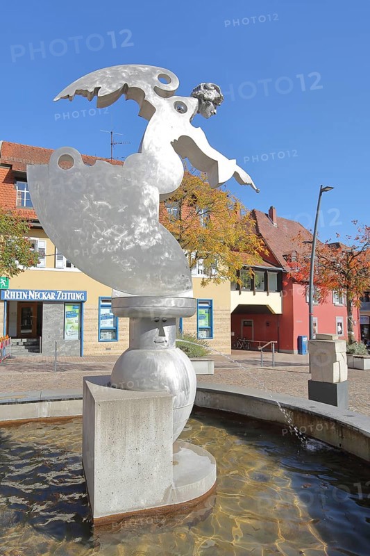 Sculpture guardian angel by Jürgen Goertz, modern art, water basin, fountain, shiny angel with index finger, silver, aluminium, fountain gallery, Adenauerplatz, Wiesloch, Baden-Württemberg, Germany