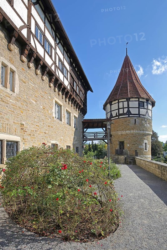 Water tower of the medieval Zollern castle built around 1255, half-timbered house, flags, stone wall, castle, Balingen, Swabian Alb, Baden-Württemberg, Germany