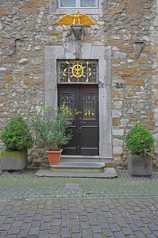 Front door with golden eagle figure to Kupferhof Schleicher, decoration, Burggasse, Rhineland, Stolberg, North Rhine-Westphalia, Germany