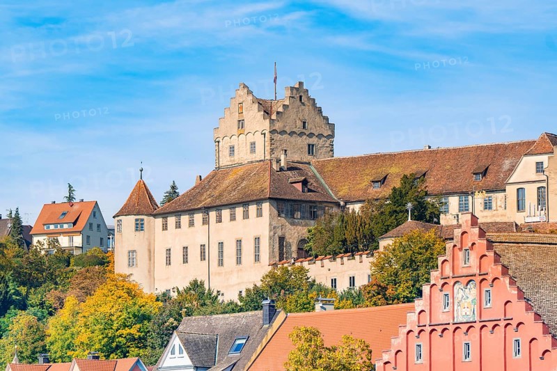 Historic castle on an autumnal hill in front of a blue sky, Meersburg, Lake Constance, Germany