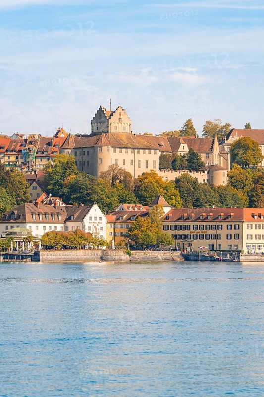 Castle and historic buildings on the lake, hills and autumn colours, Meersburg, Lake Constance, Germany