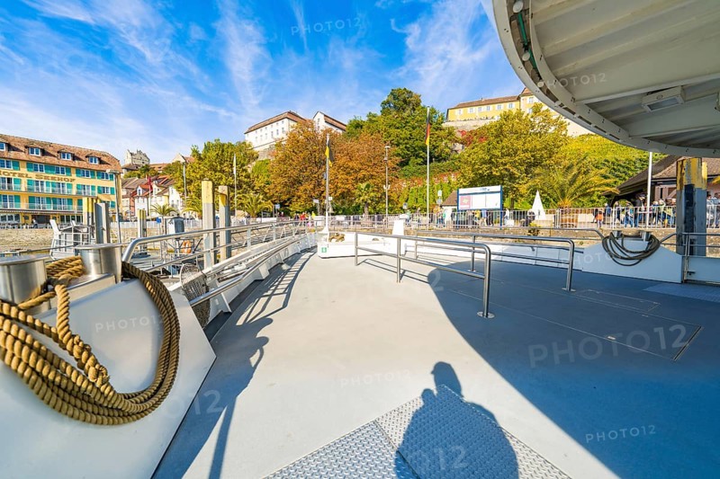 Open ship deck with a view of the shore landscape and autumn weather, Meersburg, Lake Constance, Germany