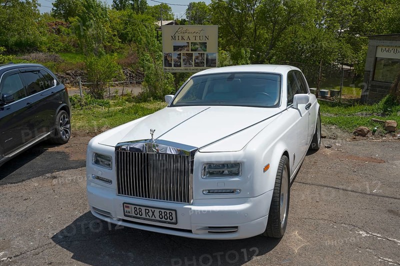 A white Rolls-Royce in a car park under trees on a sunny day, Rolls-Royce Phantom VII, Aragazotn Province, Armenia