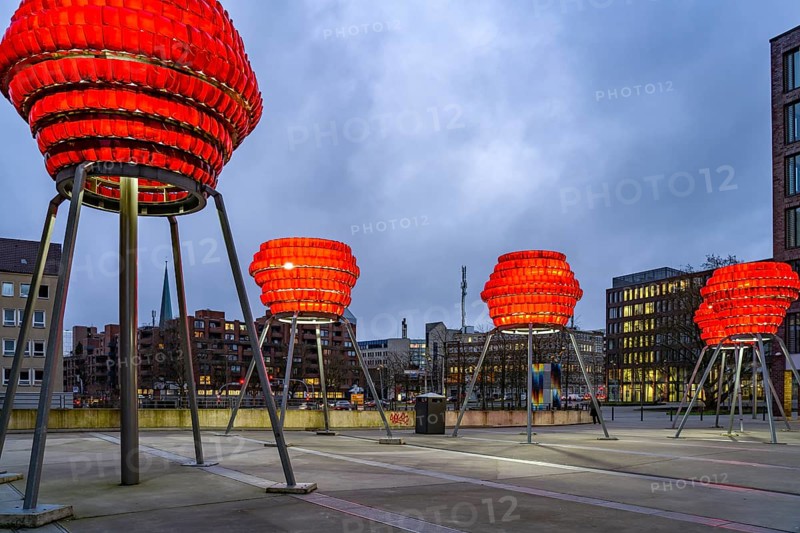 Illuminated sculptures of Dortmund roses in front of Dortmund's landmark U at dusk, Dortmund, North Rhine-Westphalia, Germany