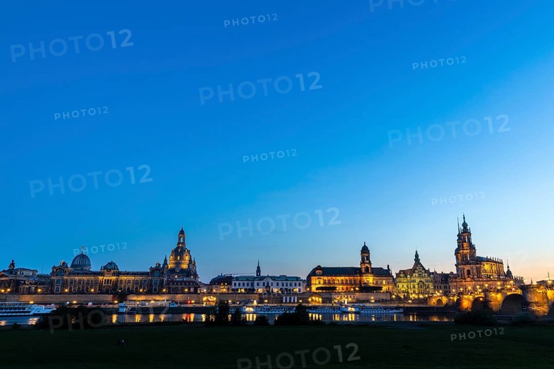 Old town skyline with Brühl's Terraces, Sanctissimae Trinitatis Cathedral, Court of Appeal, Royal Palace, Semper Opera House, Augustus Bridge, paddle steamer on the Elbe in the Blue Hour, Dresden, Saxony, Germany