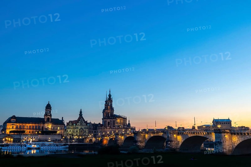 Old town skyline with Brühl's Terraces, Sanctissimae Trinitatis Cathedral, Court of Appeal, Royal Palace, Semper Opera House, Augustus Bridge, paddle steamer on the Elbe at dusk, Dresden, Saxony, Germany