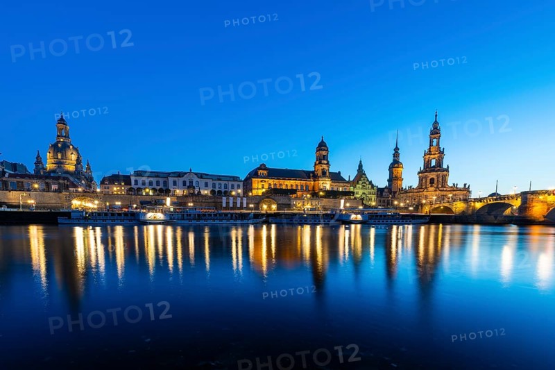 Old town skyline with Brühl's Terraces, Church of Our Lady, Cathedral Sanctissimae Trinitatis, Court of Appeal, Augustus Bridge, paddle steamer on the Elbe in the blue hour, reflection, Dresden, Saxony, Germany