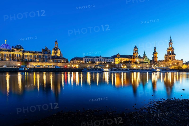 Old town skyline with Brühl's Terraces, Kunstakdeimie, Church of Our Lady, Cathedral Sanctissimae Trinitatis, Residenzschloss, Higher Regional Court, paddle steamer on the Elbe in the blue hour, reflection, Dresden, Saxony, Germany