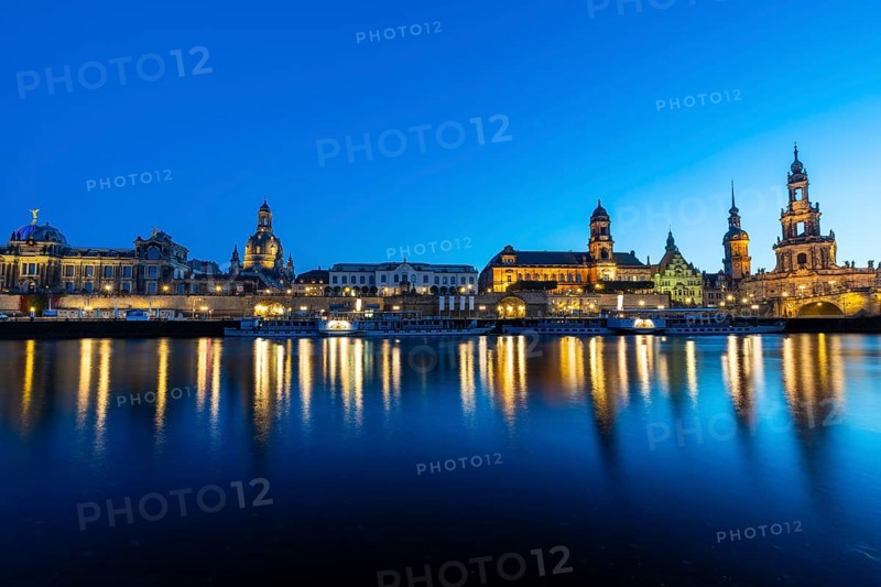 Old town skyline with Brühl's Terraces, Church of Our Lady, Academy of Fine Arts, Cathedral Sanctissimae Trinitatis, Court of Appeal, Augustus Bridge, paddle steamer on the Elbe in the blue hour, reflection, Dresden, Saxony, Germany