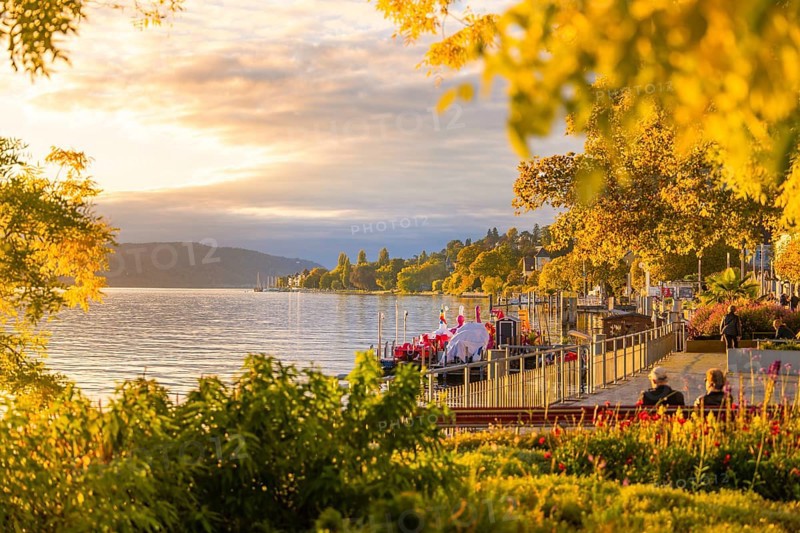 Picturesque lakeside promenade at sunset with a view over the tranquil lake, Überlingen, Lake Constance, Germany