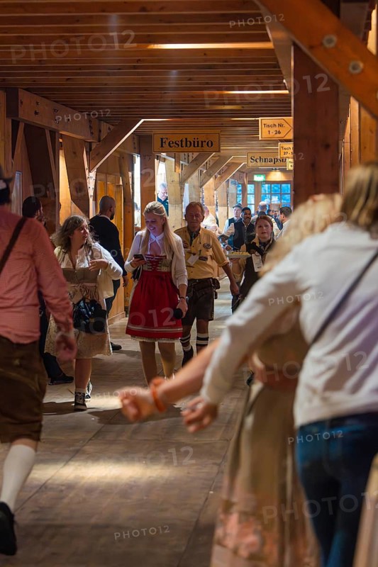 Interior shot of a marquee area with people in traditional Bavarian traditional costume, cheerful atmosphere, Cannstatter Wasen folk festival, Stuttgart, Germany