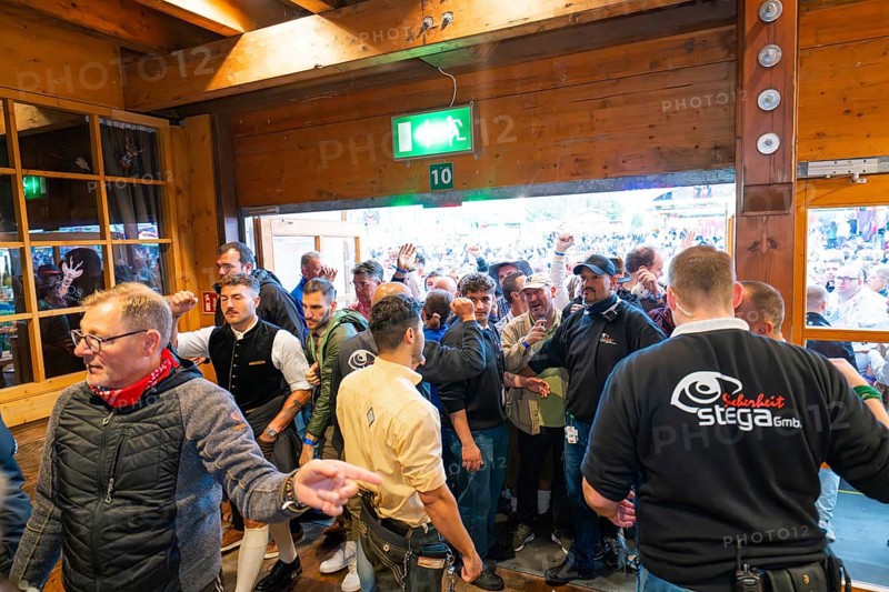 Crowd of people trying to get into the marquee, lively atmosphere, Cannstatter Wasen folk festival, Stuttgart, Germany