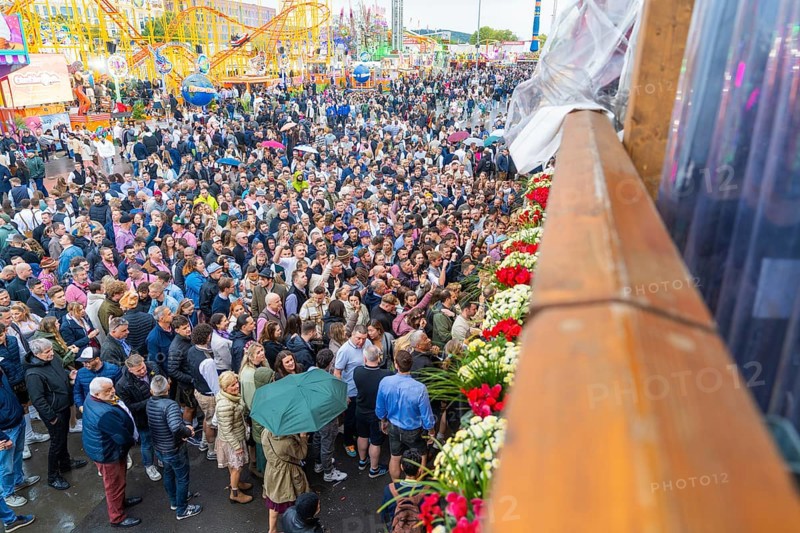 Large crowds at a colourful festival with a cheerful atmosphere, Cannstatter Wasen folk festival, Stuttgart, Germany