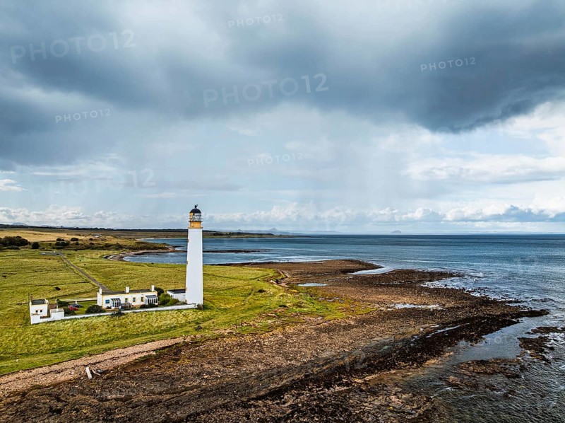Rain Clouds over Barns Ness Lighthouse from a drone, Dunbar, East Lothian, Scotland, UK