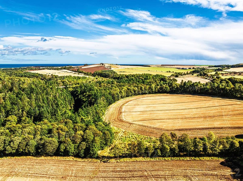 Farms and Fields over Ayton Castle from a drone, Ayton, Eyemouth, Scottish Borders, Scotland, UK