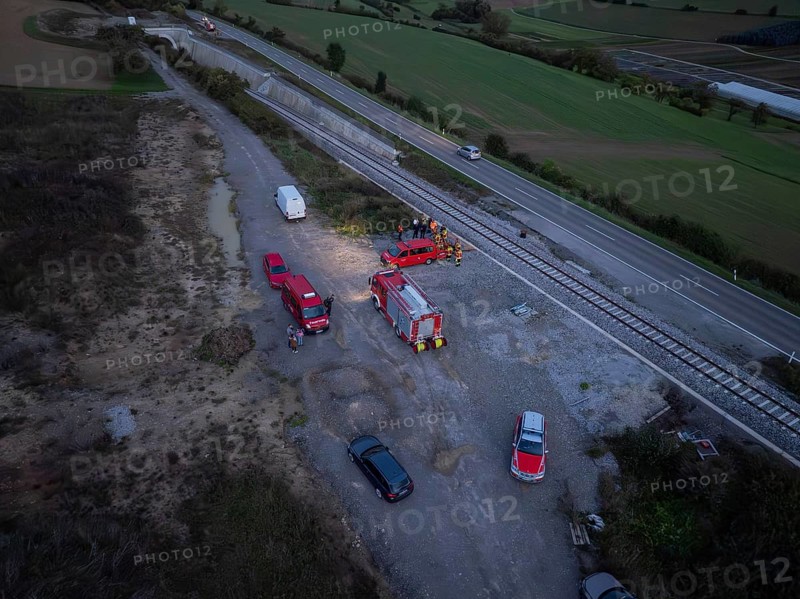 Aerial view of a rescue operation with several vehicles along the railway tracks, fire brigade exercise in the new construction tunnel of the Hermann Hesse railway, Ostelsheim, Calw district, Germany