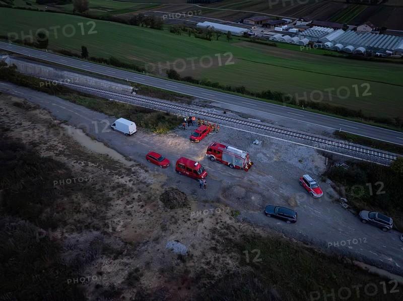 Aerial view of rescue vehicles and personnel near railway tracks and roads, fire drill in the new Hermann Hessebahn railway tunnel, Ostelsheim, Calw district, Germany