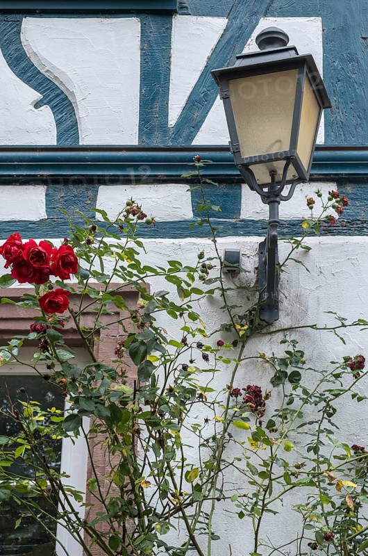Street lamp on a historic half-timbered house, Eltville, Rheingau, Hesse, Germany