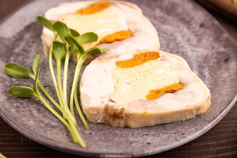 Chicken, egg and dried apricot meatloaf, microgreen on brown wooden. Diet, healthy eating. side view, selective focus