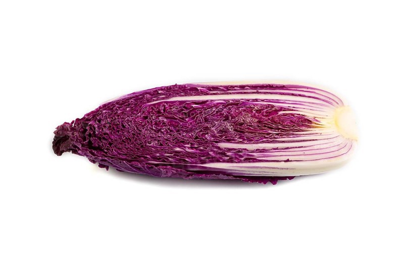 Purple Chinese cabbage isolated on white background, side view, close up, minimalism