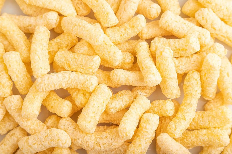 Corn flakes sticks with caramel isolated on white background. top view, flat lay, close up
