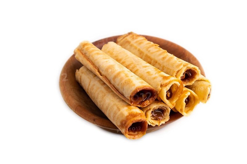 Waffles with caramel isolated on white background, side view, close up