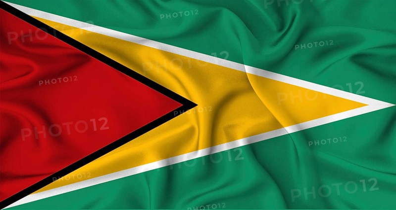 Realistic Guyana flag waving. Close up of flag of Guyana with cloth texture