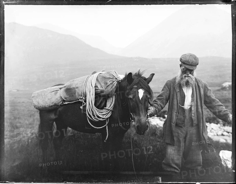 Old man with pack horse carrying mountaineering equipment, thought to be Cuillin mountains, Skye, Scotland, UK c 1900-1920