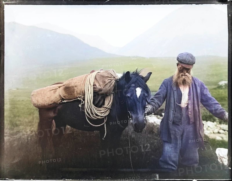 Colourised image of old man with pack horse carrying mountaineering equipment, thought to be Cuillin mountains, Skye, Scotland, UK c 1900-1920