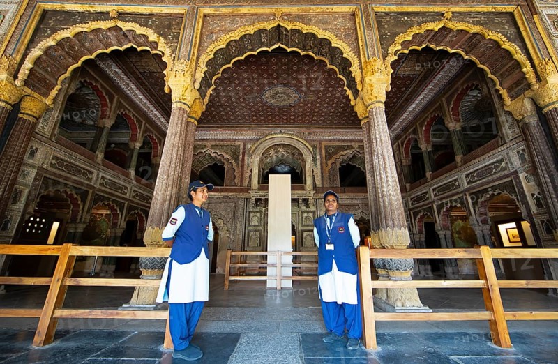 Indian woman guarding the Daria Daulat Bagh or Tipu Sultan's summer palace, Srirangapatna, Karnataka, India