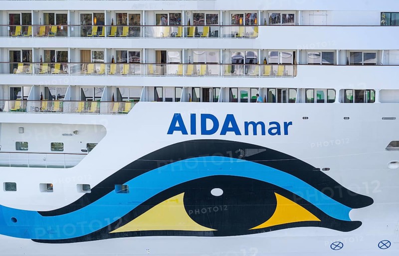 Close-up of an AIDA cruise ship with balconies and striking blue and yellow livery, Warnemünde, Rostock, Mecklenburg-Western Pomerania, Germany