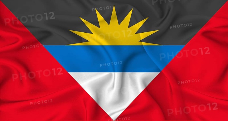 Realistic Antigua and Barbudan flag waving. Close up of flag of Antigua and Barbuda with cloth texture