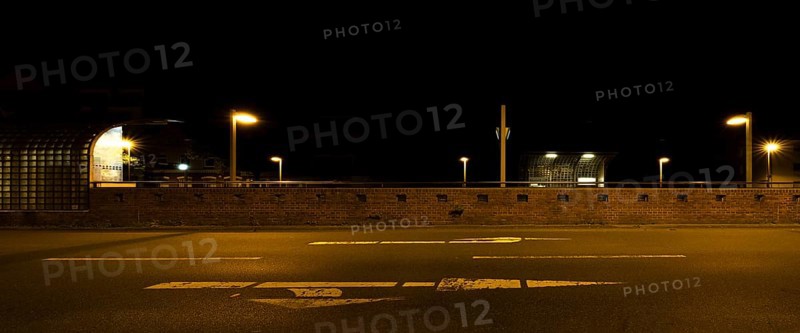 View across the street to the city railway station Stadtfriedhof Stöcken at night, Stöcken, Hanover, Lower Saxony, Germany