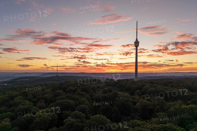 TV tower at dawn with dramatic clouds over forested area, Stuttgart-Degerloch, Baden-Württemberg, Germany