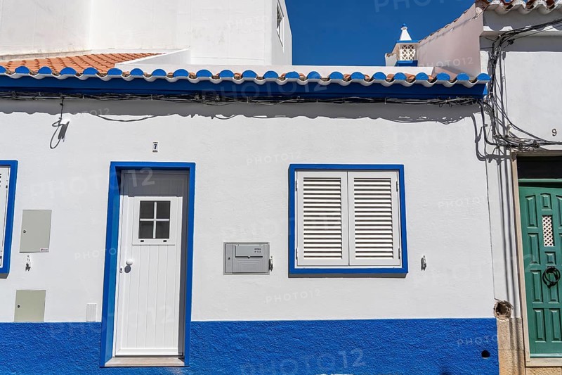 Facade of buildings in Tavira, old town, in the east of the Algarve, Portugal