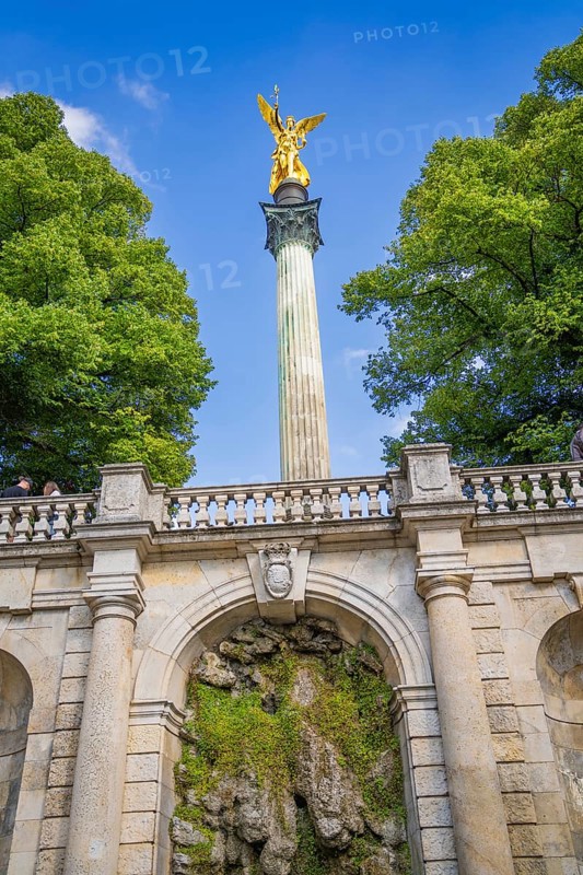 A magnificent golden statue on a column above a staircase, Munich, Germany