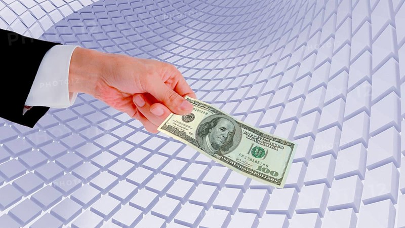 Symbolic image, hand extends 100-dollar note, Wall Street and Dax upswing, President Trump's erratic decisions, global tariffs, share prices, euro, euro exchange rate, euro high, exchange rates, dollar parity, financial investment, recession worries, inflation, exports, raw materials and primary products in dollars, oil in dollars, world crisis, Ukraine war, Germany, loss of democracy, autocracy, China, Russia