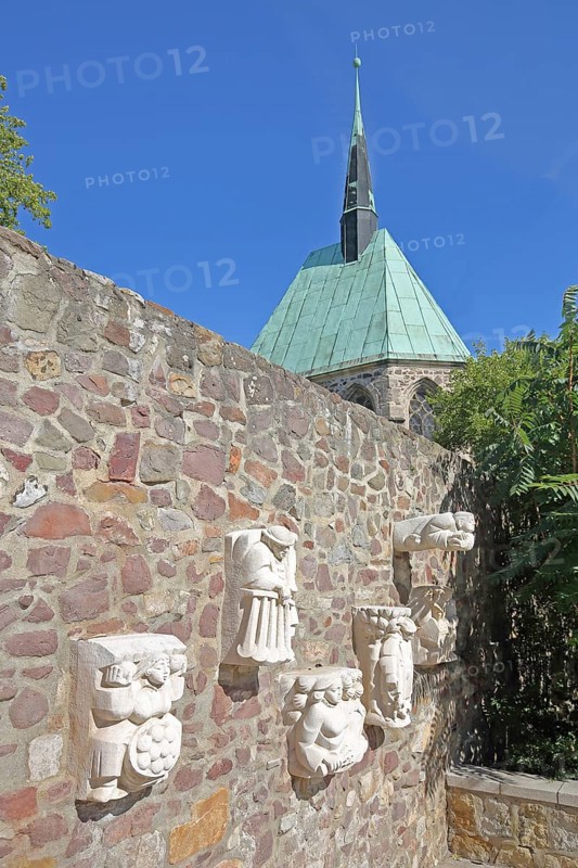Sculptures of Magdeburg originals on the city wall and the Gothic Magdalen Chapel, Magdeburg, Saxony-Anhalt, Germany