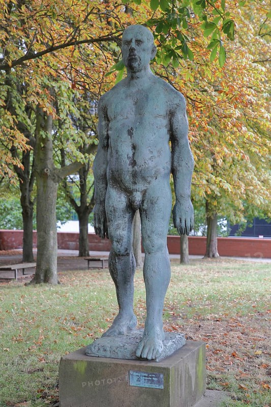 Sculpture Large striding man by Wieland Förster 1969, bronze sculpture, nude male figure, walking, life-size, sculpture park, Magdeburg, Saxony-Anhalt, Germany