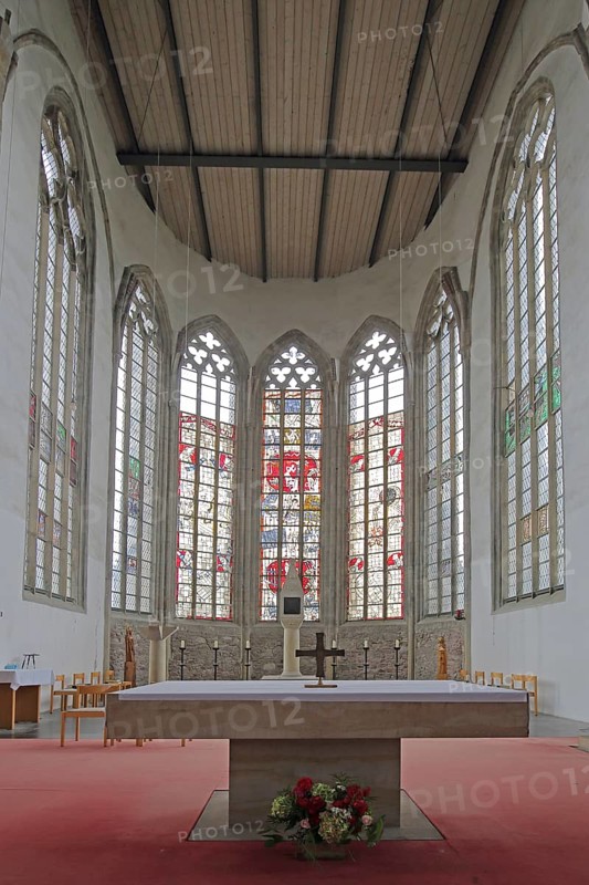 Chancel with colourful stained glass windows and altar, interior view, St. Petri Church, Magdeburg, Saxony-Anhalt, Germany
