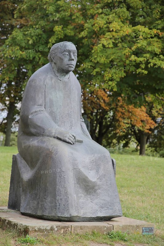 Sculpture Käthe Kollwitz by Gustav Seitz 2010, monument to the paintress, sculptor, seated female figure, bronze sculpture, modern art life-size, sculpture park, Magdeburg, Saxony-Anhalt, Germany