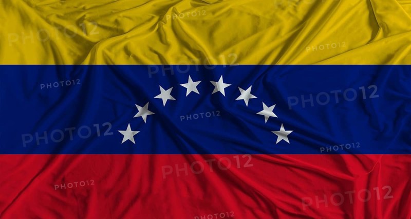 Venezuelan flag with fabric texture background. National flag of Venezuela with cloth texture
