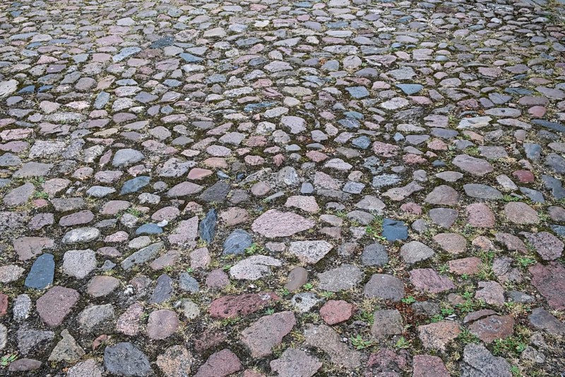 Cobblestone street of irregularly arranged grey stones, North Rhine-Westphalia, Germany