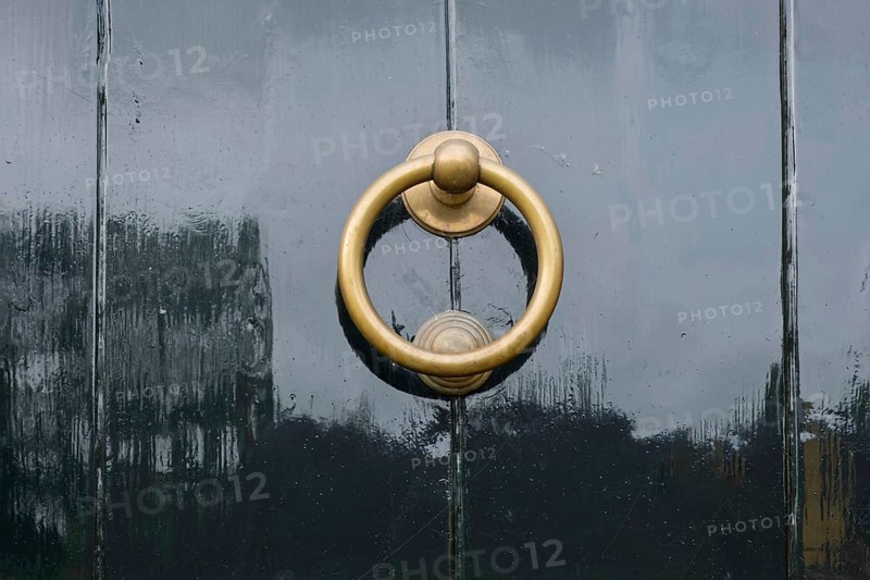 Door knocker on a black front door, Province of Groningen, Netherlands