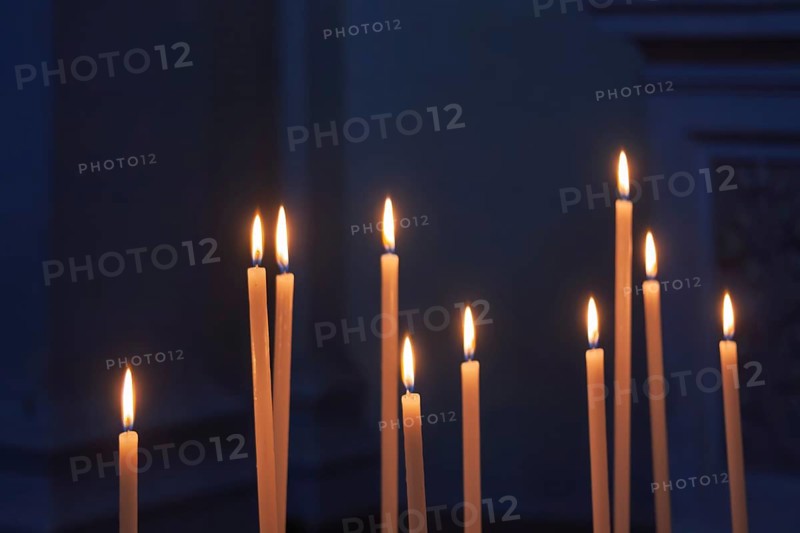Sacrificial candles in a church, Tuscany, Italy