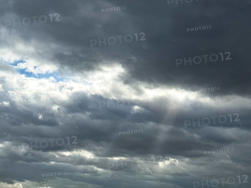 Heavily overcast sky with cloud cover Dense cloud cover Nimbostratus clouds Rain clouds, rays of sunshine shine through gaps, international