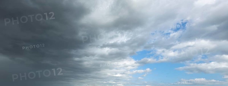 Panorama photo from left cold front clouds of cumulus clouds right in front altocumulus clouds and stratocumulus clouds, international