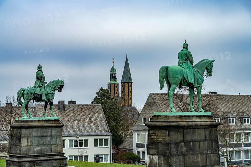 Equestrian statues of Emperors Barbarossa and Wilhelm I of the Imperial Palace and the towers of the market church of St Cosmas and Damian in Goslar, Lower Saxony, Germany