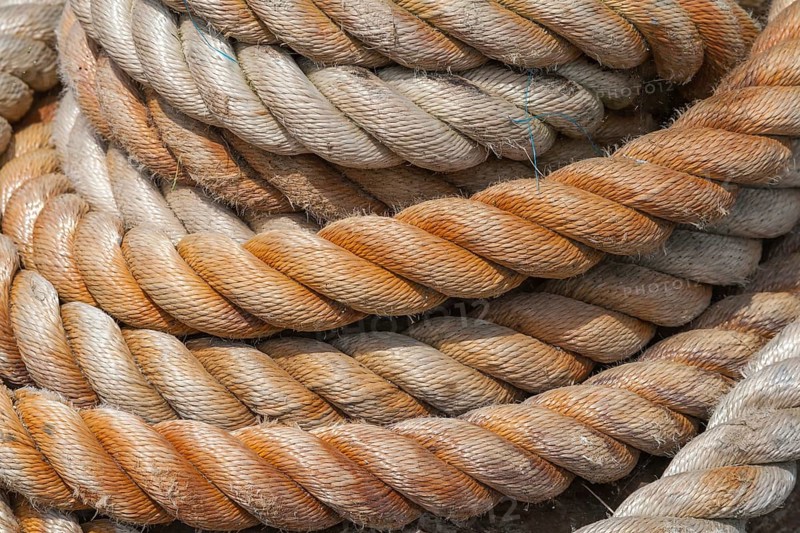 Close-up of several twisted ropes in shades of beige and brown with a clear texture, East Frisia, Lower Saxony, Germany