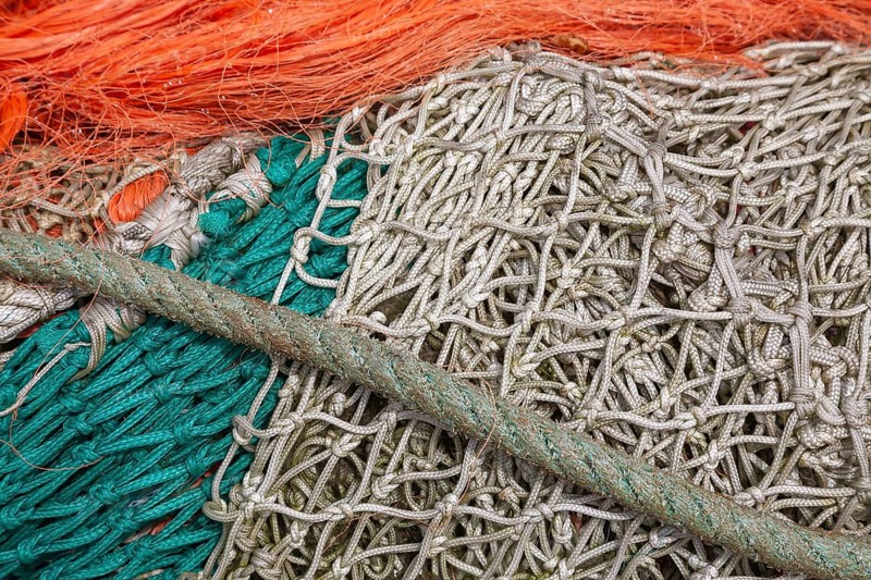 Complex structure of brightly coloured fishing nets and ropes in vivid colours, Greetsiel, East Frisia, Lower Saxony, Germany